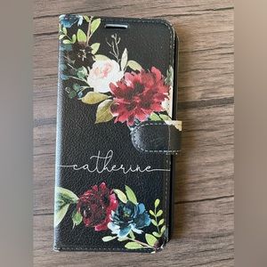 A personalized black flower IPhone 12 ProMax case